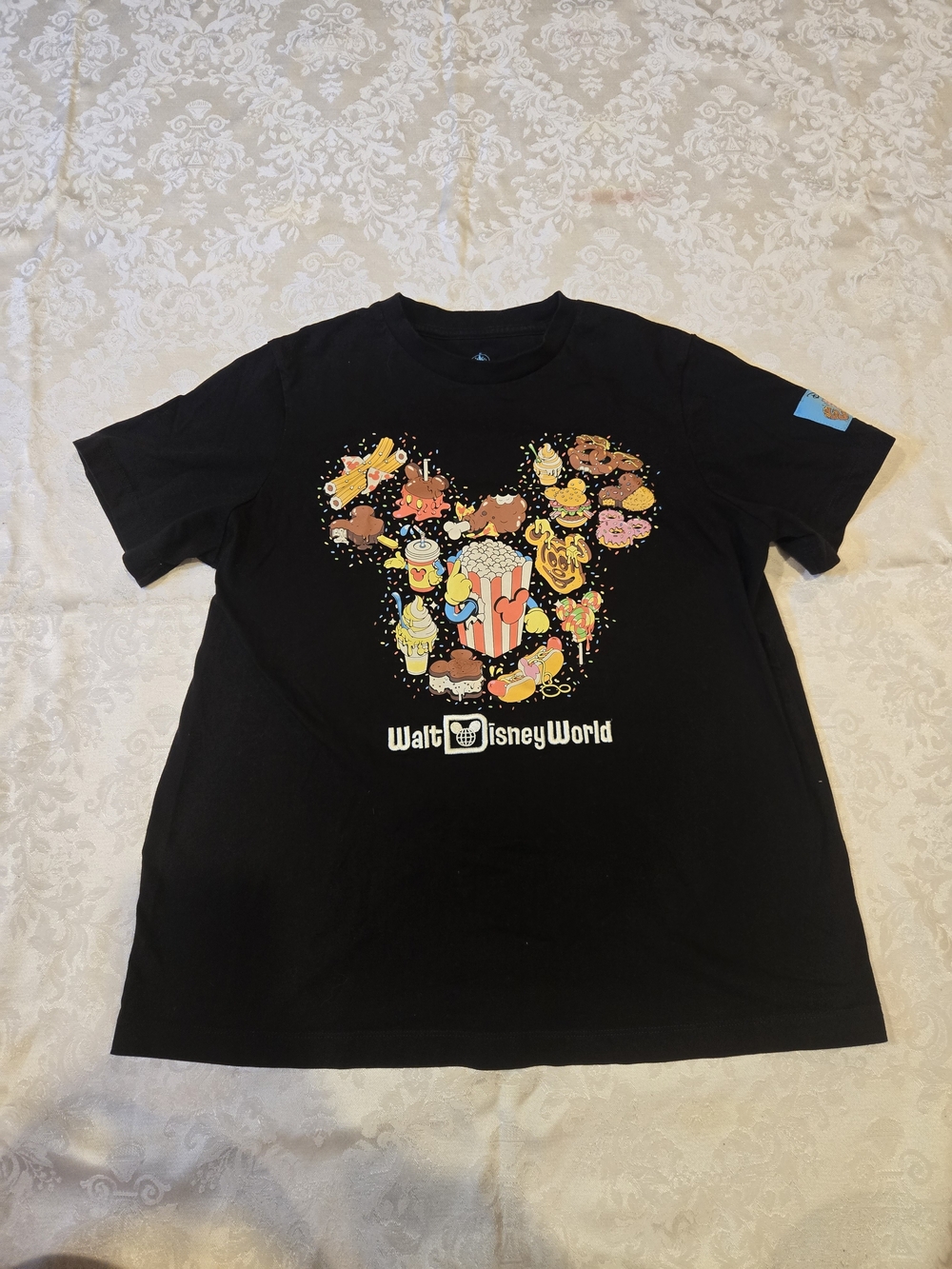 Disney Black Tee with Colorful Snack Patch